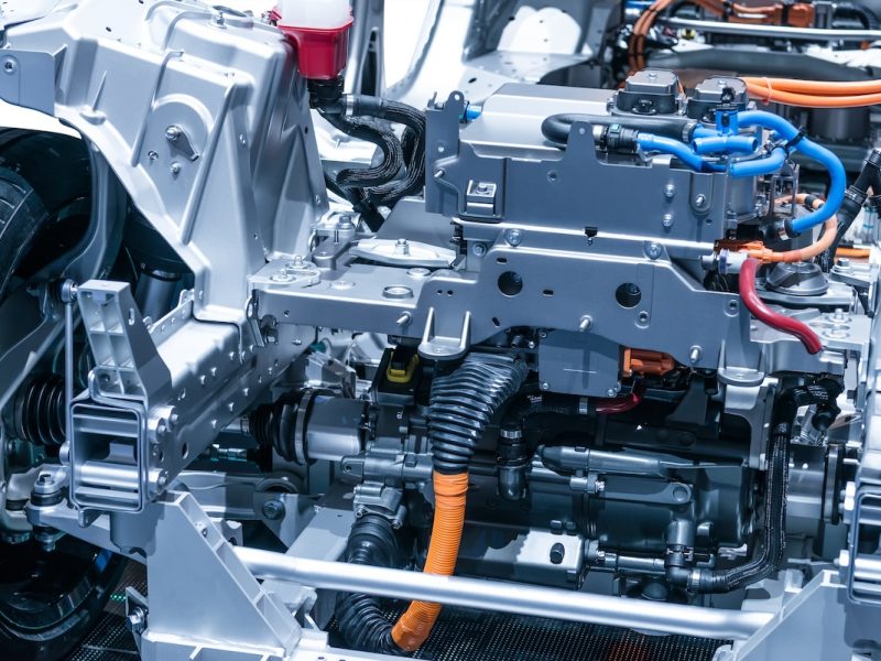 Chassis of the electric car with powertrain and power connections closeup.